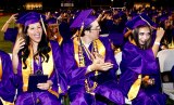 Lemoore High grads turn their tassels as instructed at the end of Thursday night's Lemoore High School 2022 graduation ceremony.